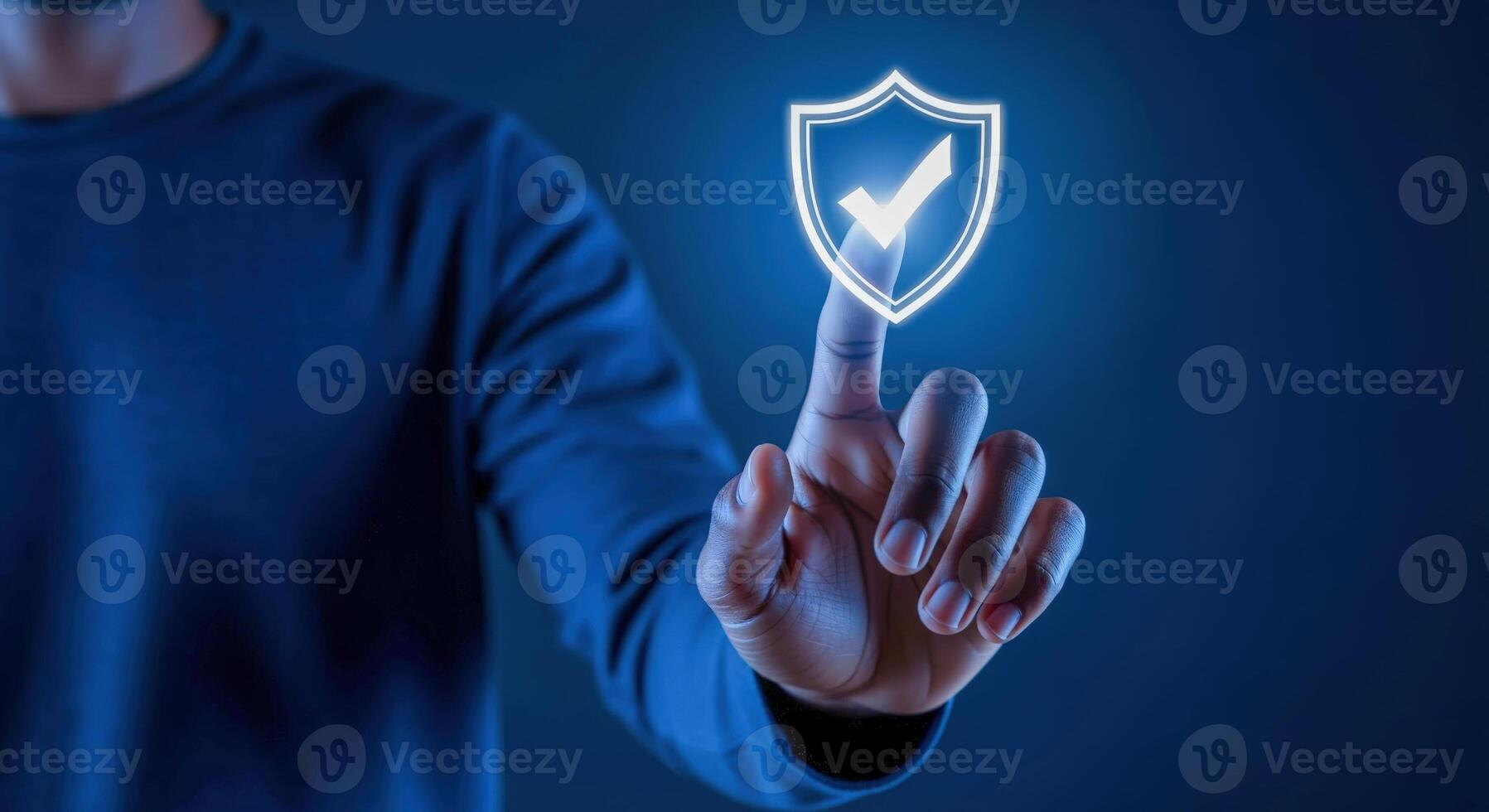 Cybersecurity Concept Man Touches Glowing Shield with Checkmark, Ensuring Digital Data Protection and Privacy photo