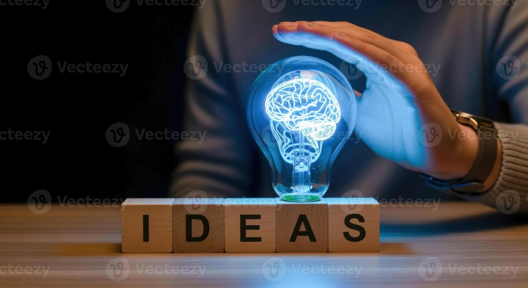 Creative Thinking Concept Brain Visualization Inside a Light Bulb with Ideas Blocks on a Table photo