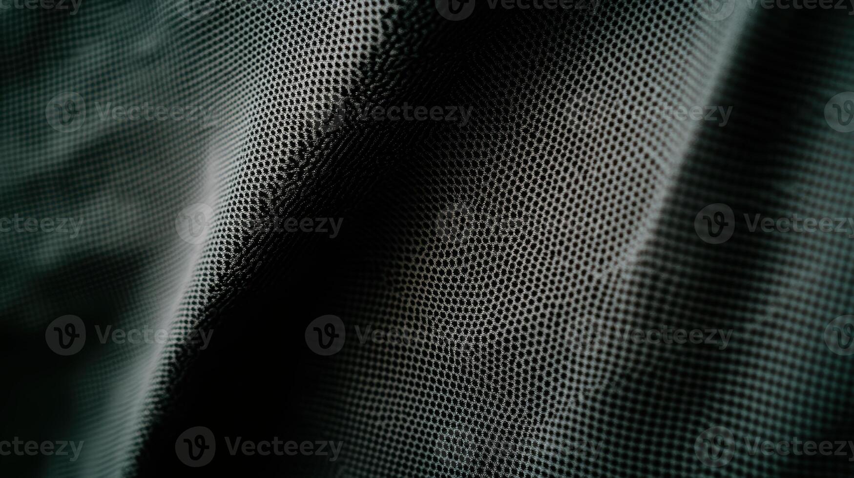 Close-up view of textured fabric showcasing intricate patterns in soft light photo