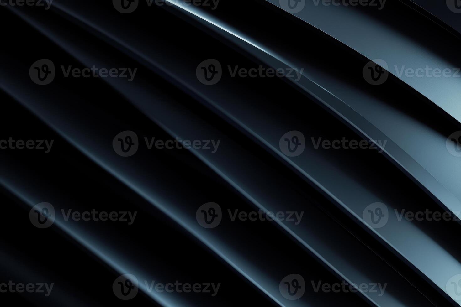 Abstract curves of smooth metallic surface reflecting light in dark setting photo