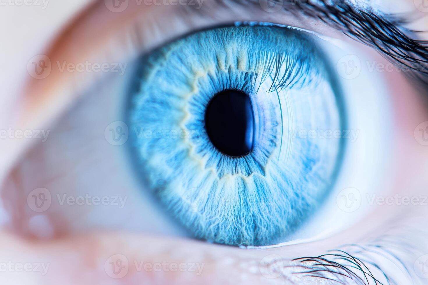 Close-up view of a striking blue eye with intricate details and patterns photo