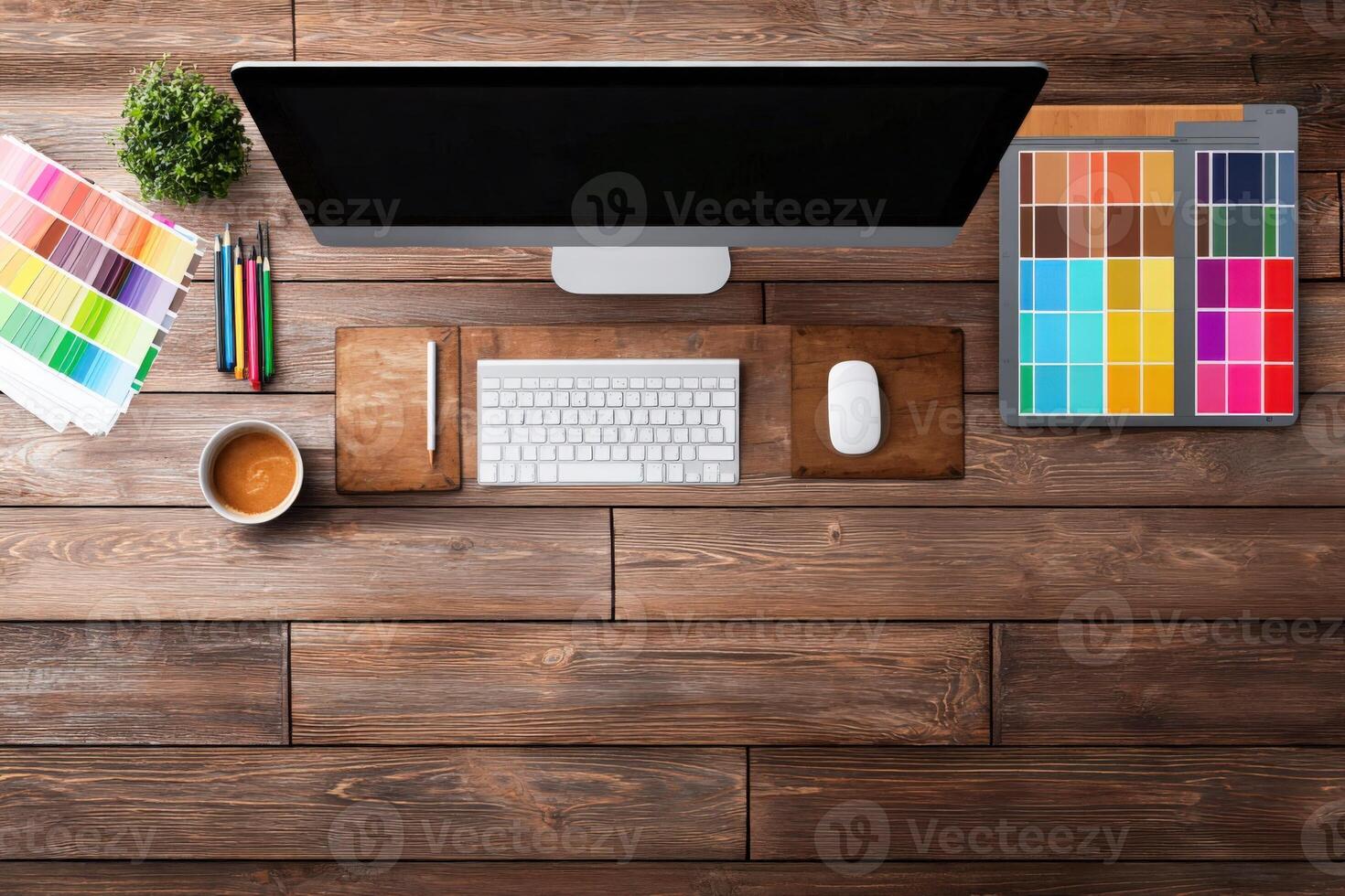 Designers Workspace Flat Lay Modern Computer Setup with Color Palettes and Creative Tools on Wood Table photo