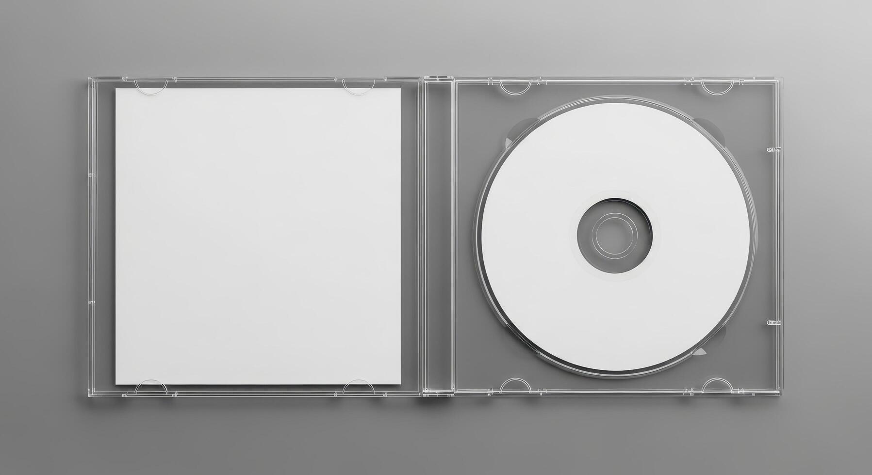 Overhead flat lay of an open transparent plastic case containing a blank white compact disc and a square paper booklet, ideal for music or data mockup on a gray background photo