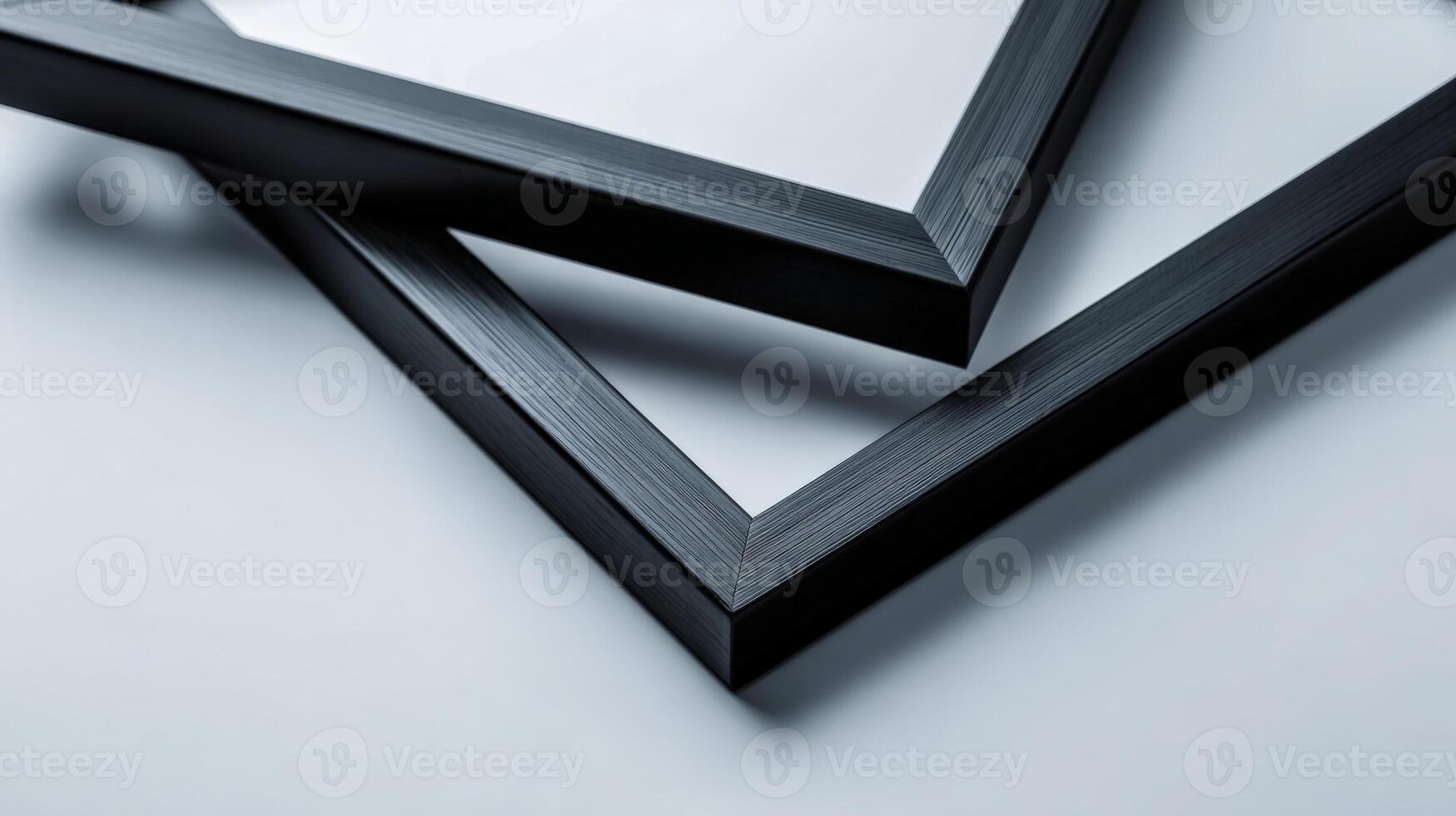 Close-up of Two Black Picture Frames Angled on White Surface for Mockups and Product Display photo
