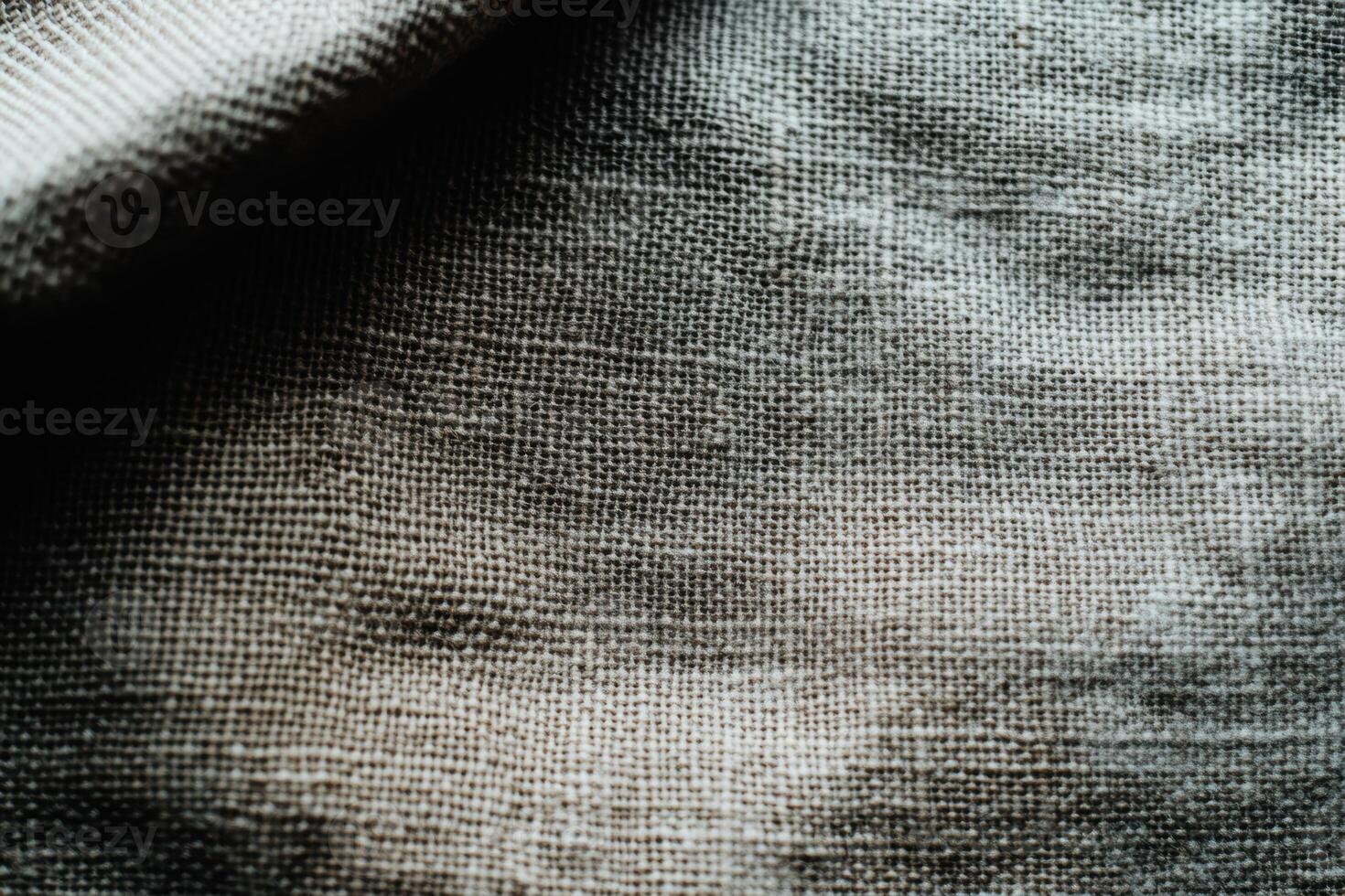 Textured fabric displaying intricate patterns and natural light play photo