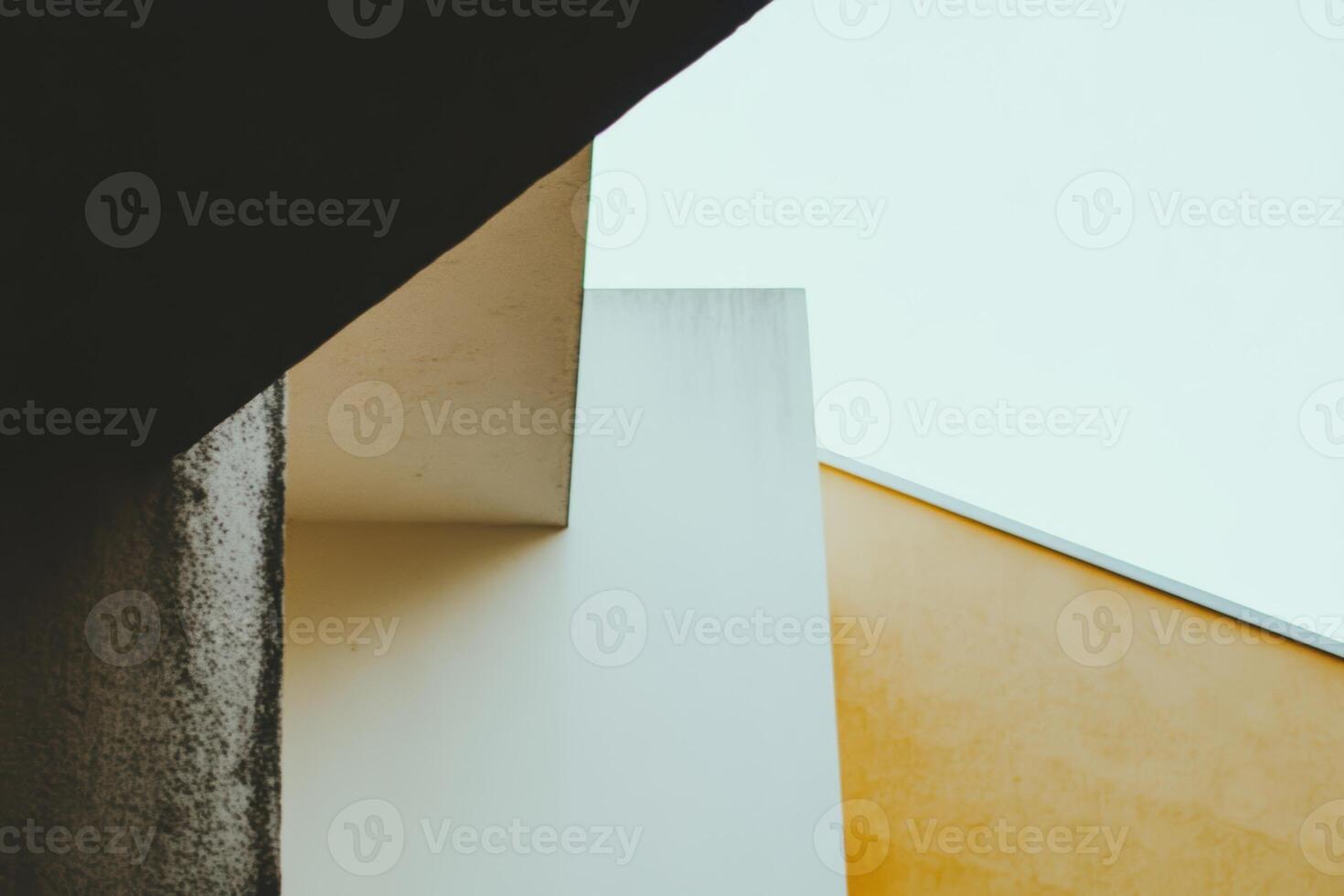 Unique architectural lines and angles under a clear sky in an urban setting photo