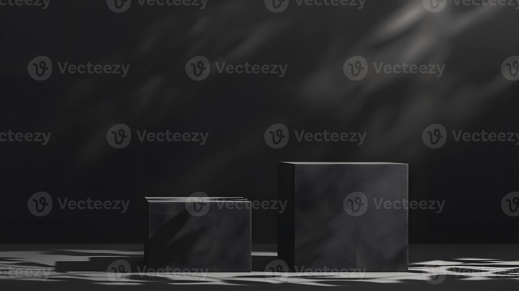 Two Dark Gray Cubic Display Platforms with Shadow Patterns photo