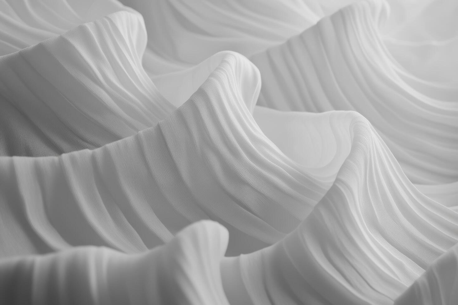 Delicate white fabric folds create a soft, flowing texture in gentle light photo