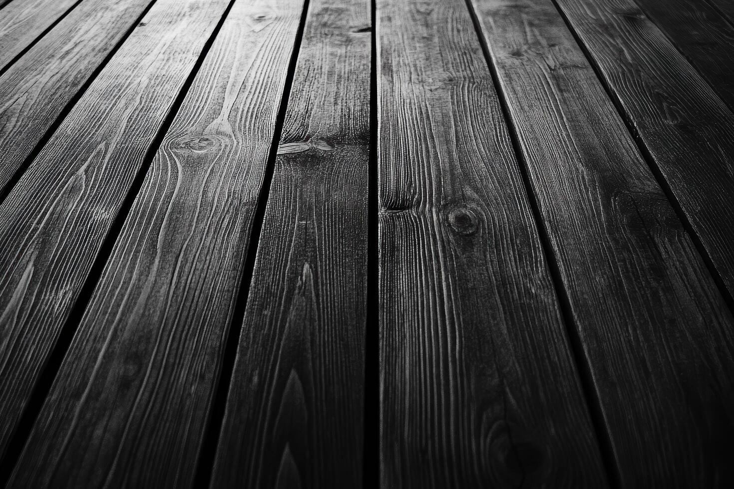 Dark wooden floor with visible grain patterns and texture in natural light photo
