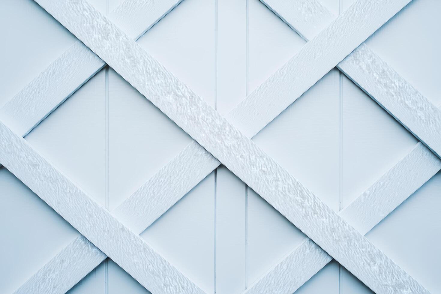 Wooden lattice design in light blue with diagonal patterns on a fence photo