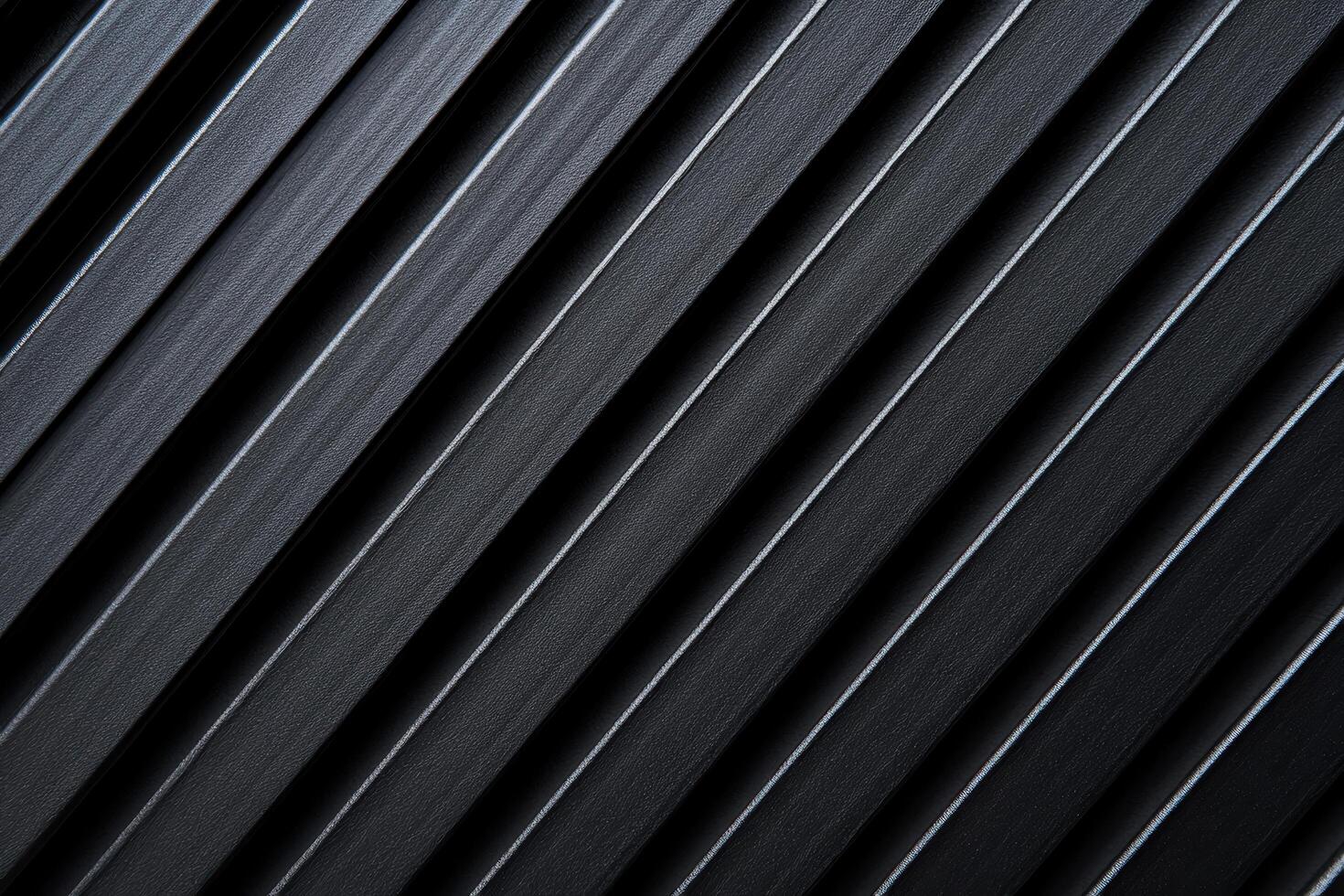 Dark textured surface with diagonal lines creating a striking pattern photo