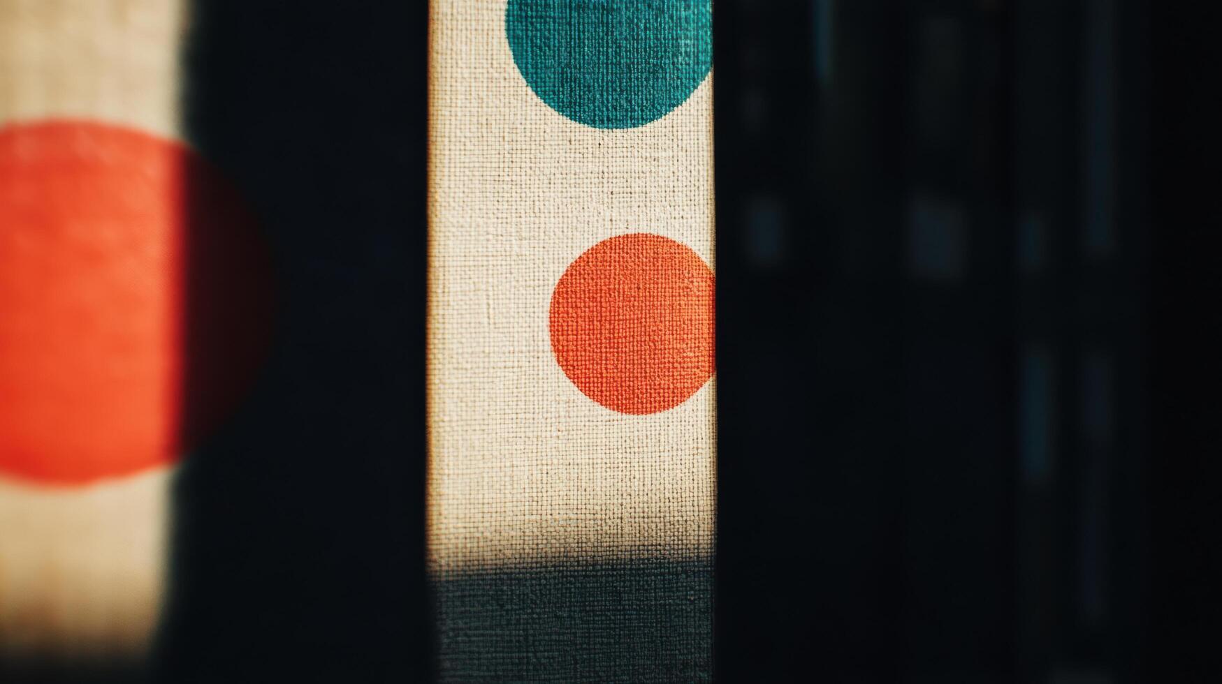 Colorful patterns create striking shadows on textured fabric in bright light photo
