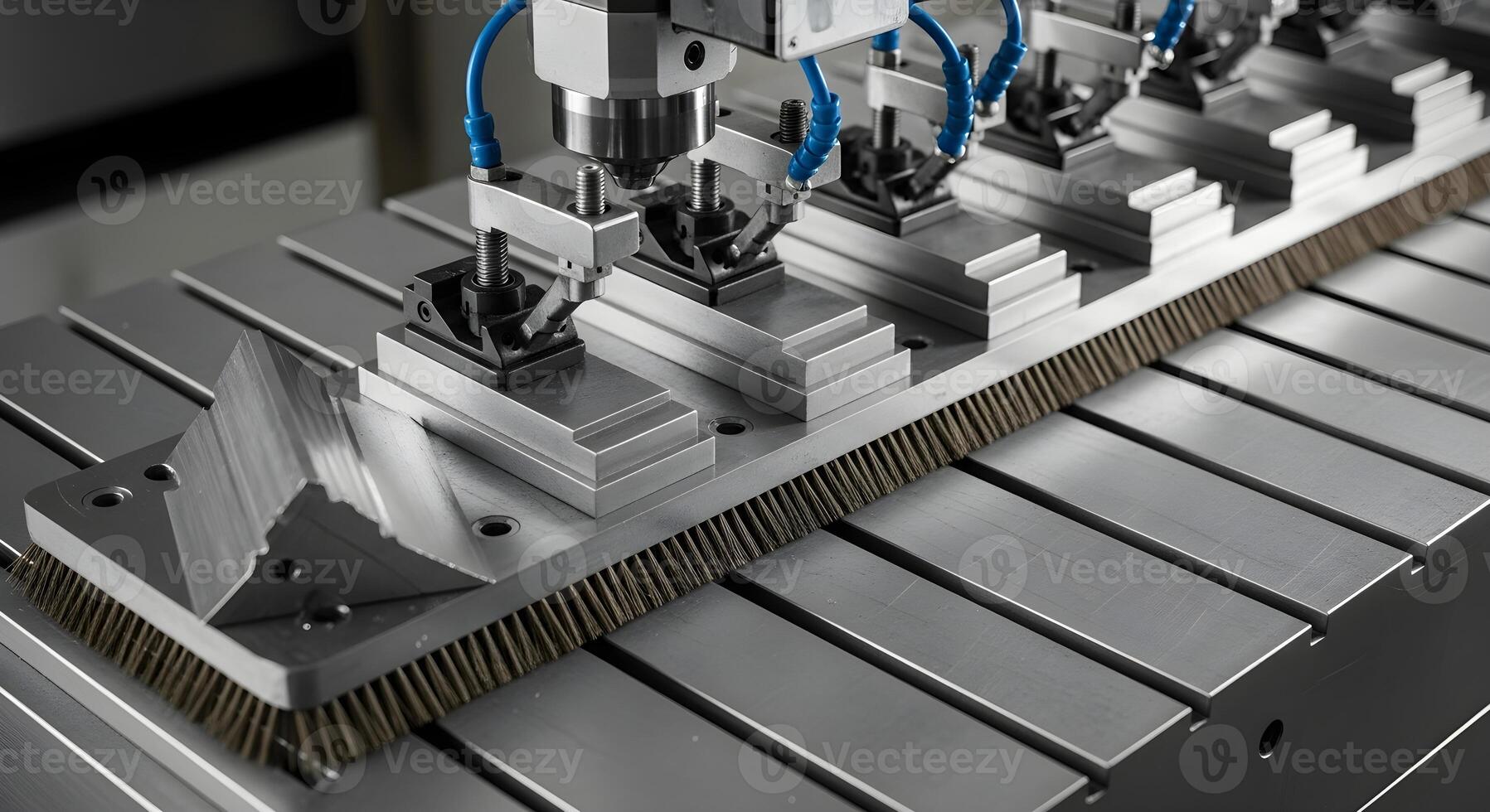 Angle plate with clamps and step blocks in deburr station. Brush marks on stainless surface with ultra-sharp textures. photo