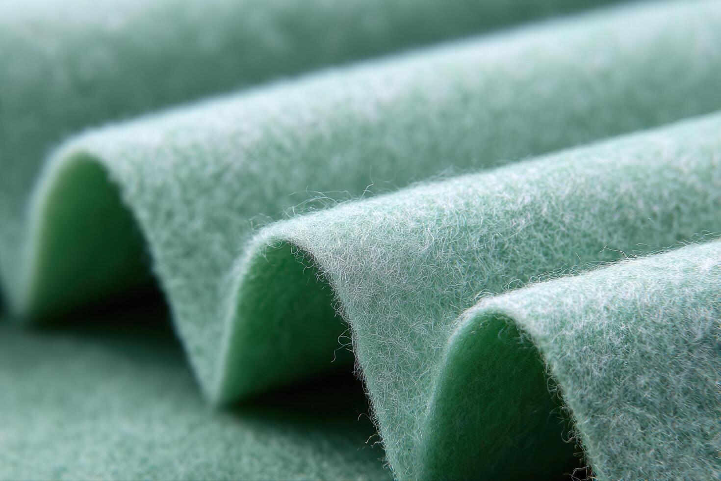 Soft green felt fabric texture with gentle folds, perfect for craft projects and design photo