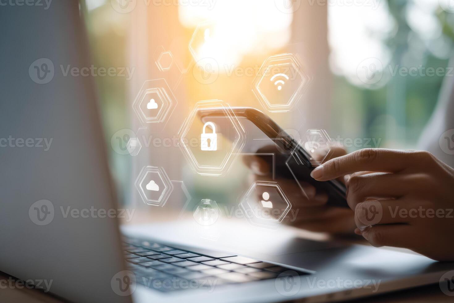 Person using smartphone with digital security icons overlay on a laptop and window background photo