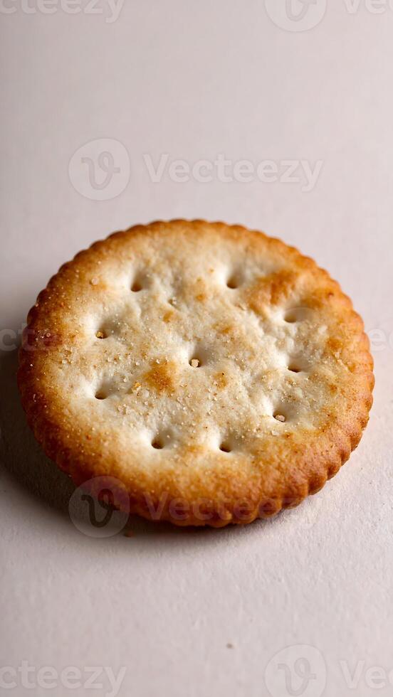 Crispy golden cracker with textured surface and perfect salty crunch for snacking photo
