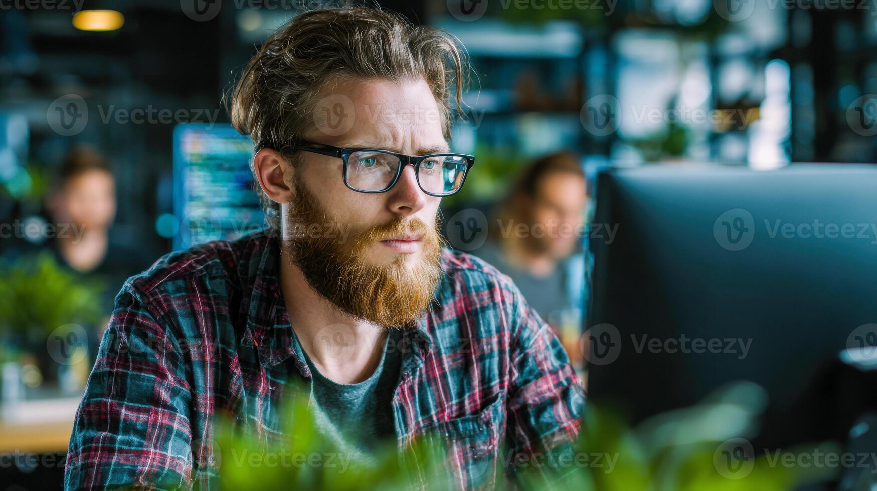 Focused software developer engaged in a programming session in a tech workspace photo