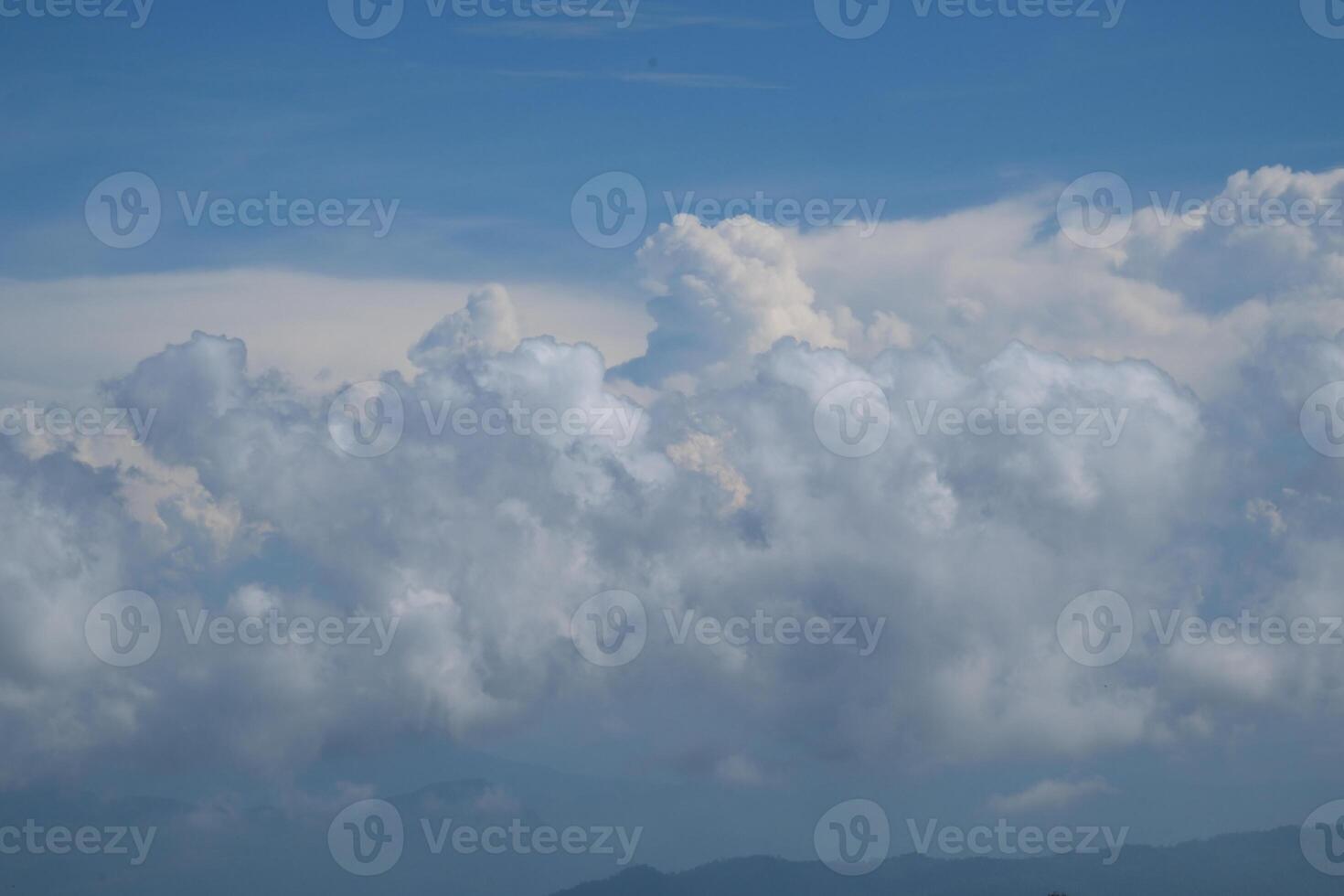 High nature view large white clouds on soft sky background in the morning, View of white cloudy on the plane. photo