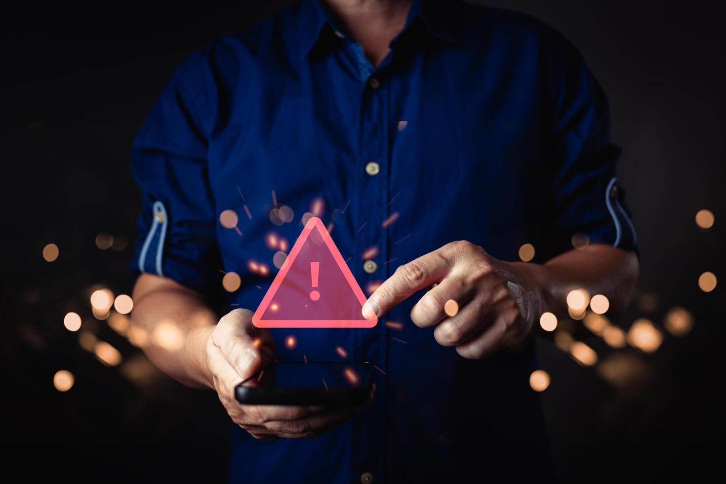 A person interacts with a smartphone, trigger a glow red warning symbol with an exclamation mark. The digital caution alert appears surrounded by bokeh lights, symbol a notification or error message. photo