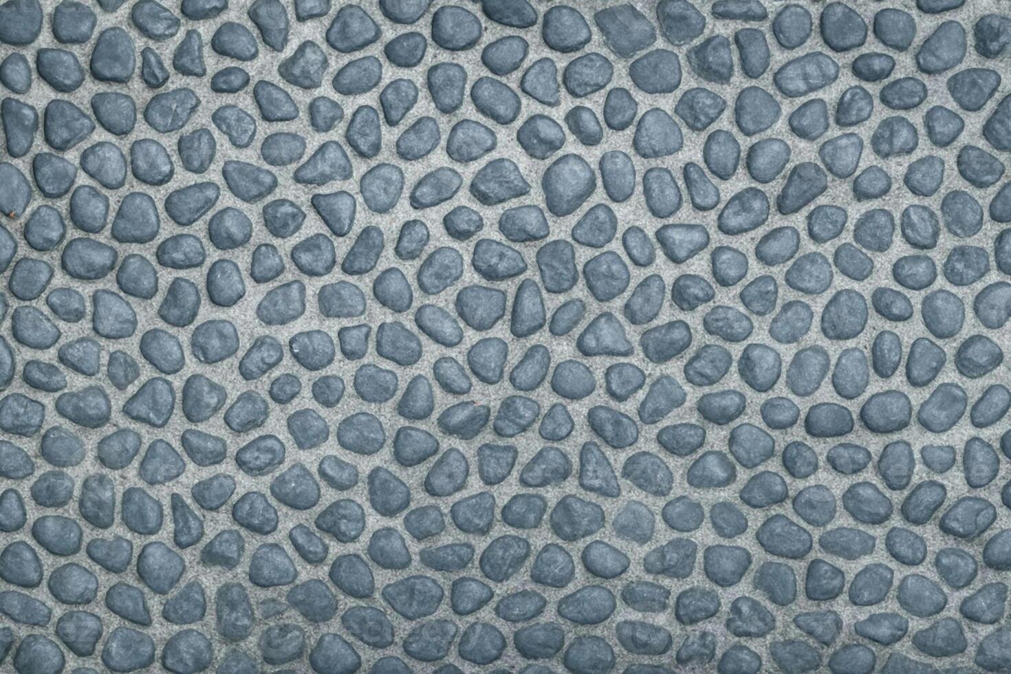 Blue Gray Pebble Surface With Evenly Sized Rounded Stones Creating Consistent Textured Field photo