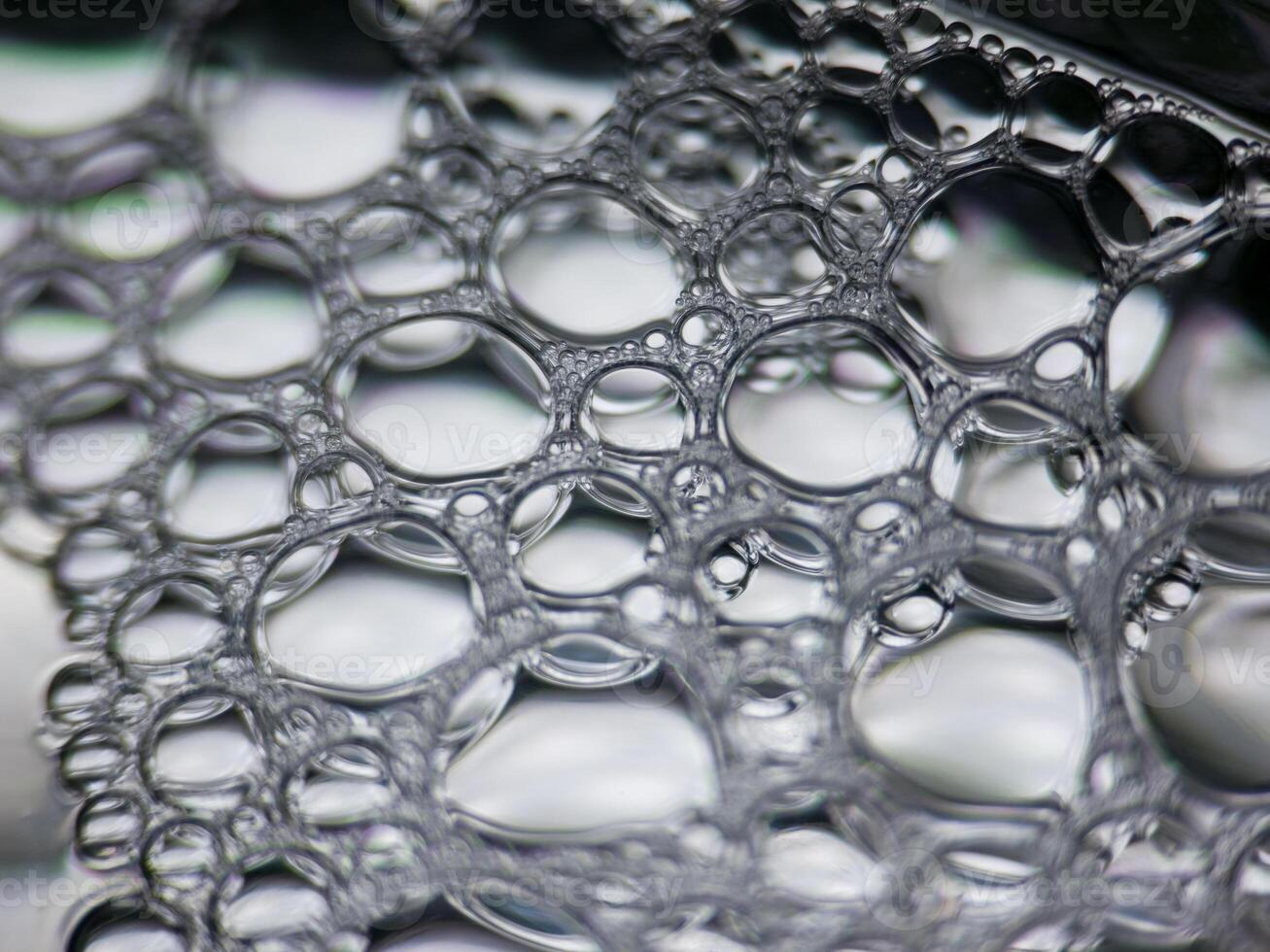 Closeup macro view of soap bubbles forming abstract pattern photo
