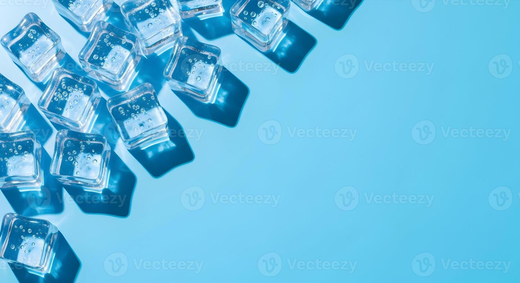 Refreshing cool ice cubes with bubbles on blue background top view for summer beverage themes and frozen texture concepts photo