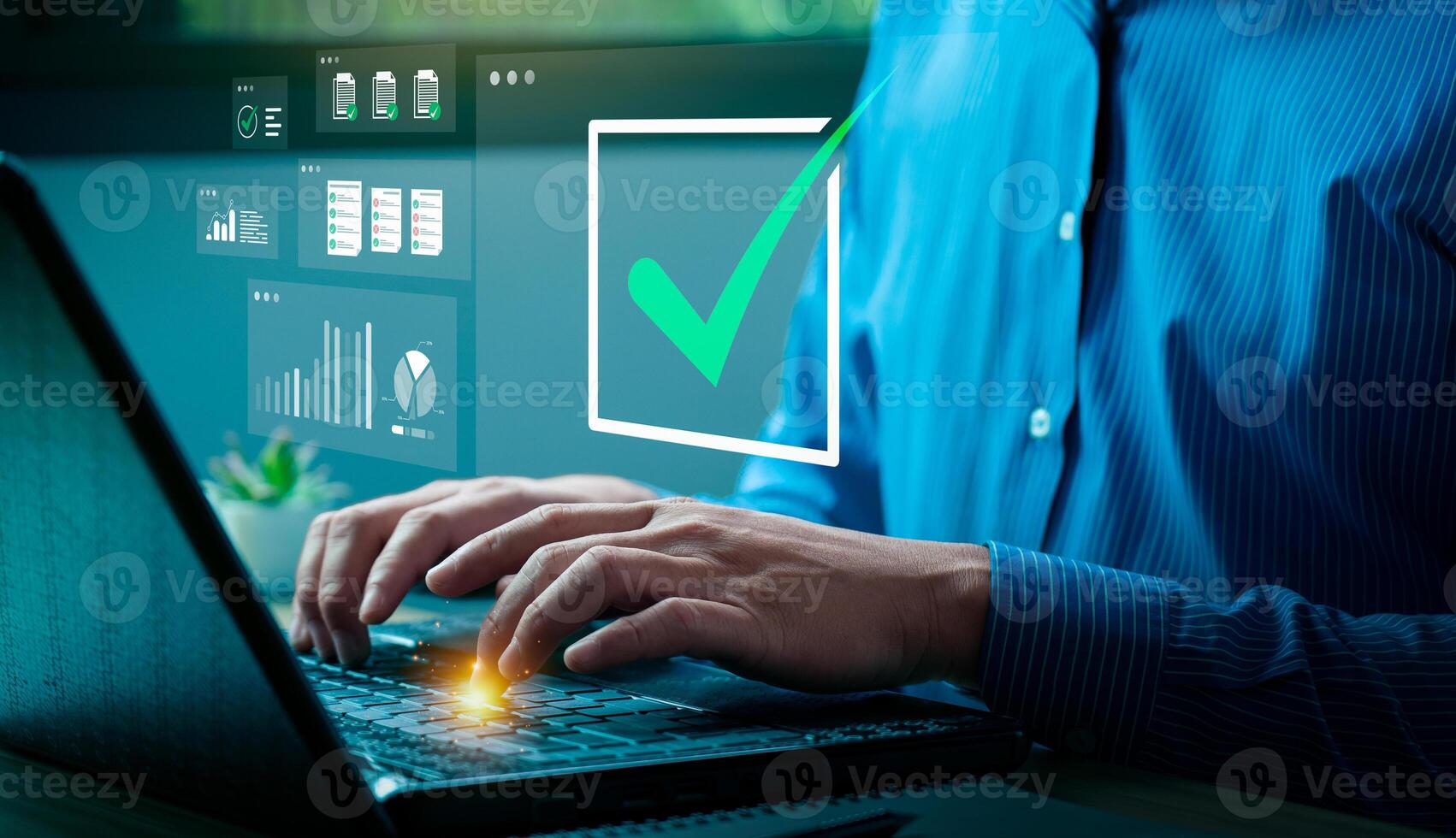 Businessman typing on laptop with virtual check mark and data analytics icons, representing task completion, digital approval process, project management, performance monitoring, and business success photo