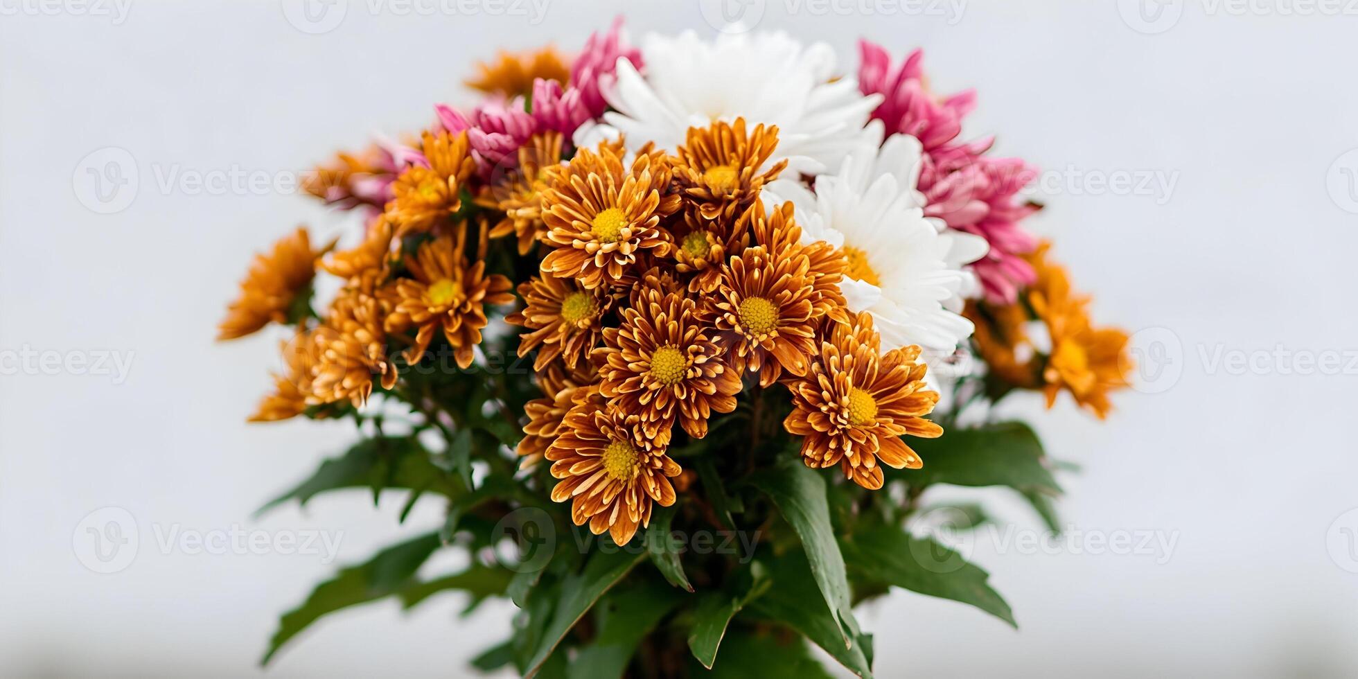 Close up of a bouquet of chrysanthemums in orange white and pink photo