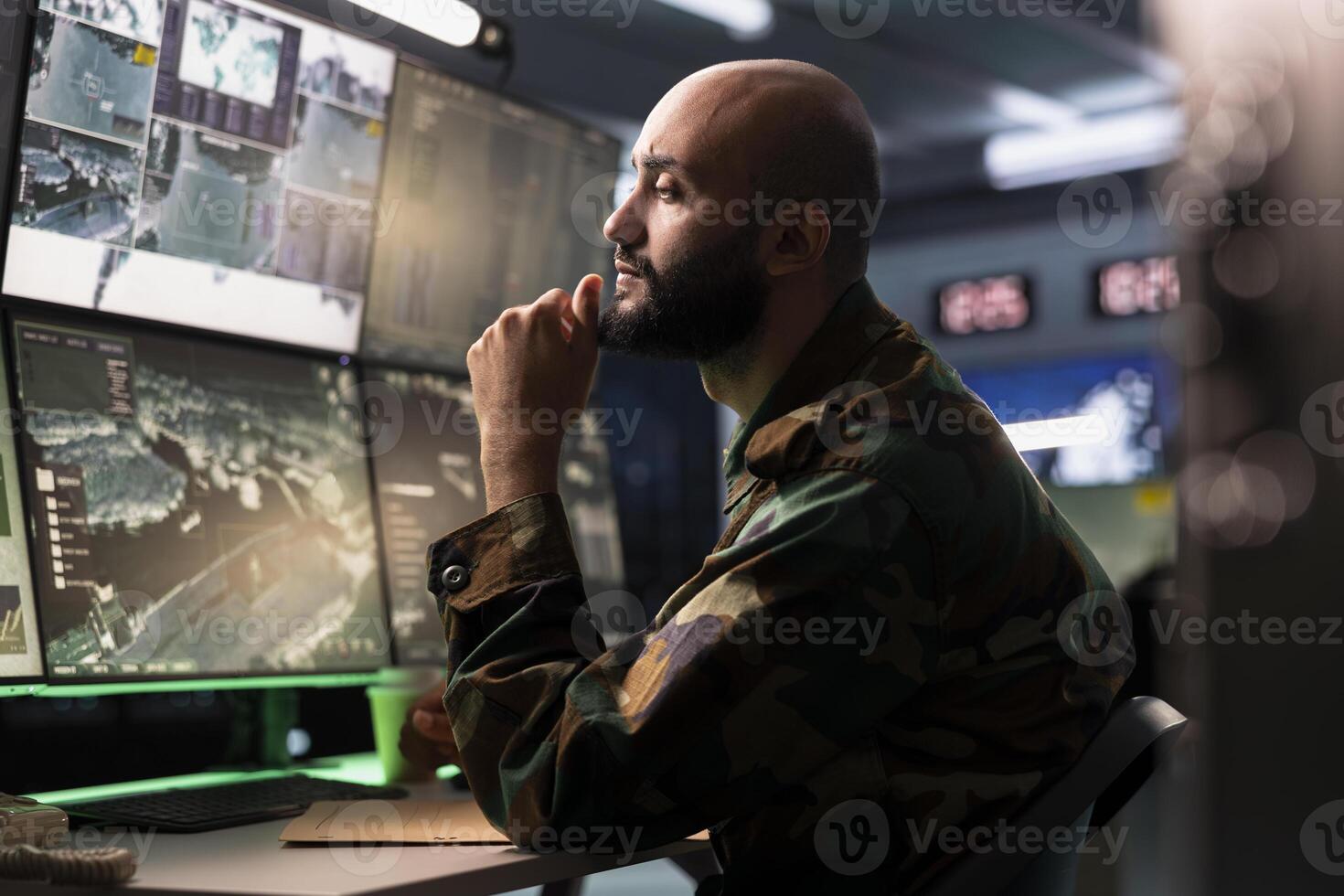 Air defense operative in war room using radar to detect ballistic missiles. Army soldier in base of operations scanning rockets approaching national borders using satellite hardware, deploying shields photo