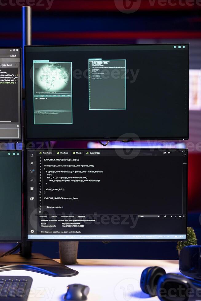 Spyware exploit software running on computer in secret base of operations used by hacker to steal data. Programming language script on screen in empty hideout used by cybercriminal targeting firewalls photo