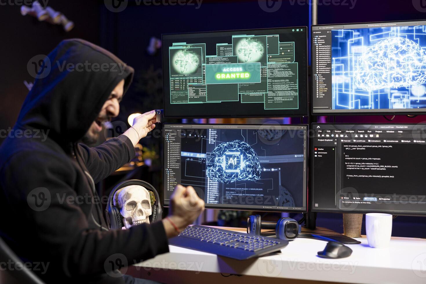 Ecstatic hacker doing covert operations celebrating after bypassing security using USB virus. Rogue programmer overjoyed after successfully penetrating firewalls, getting access granted message photo