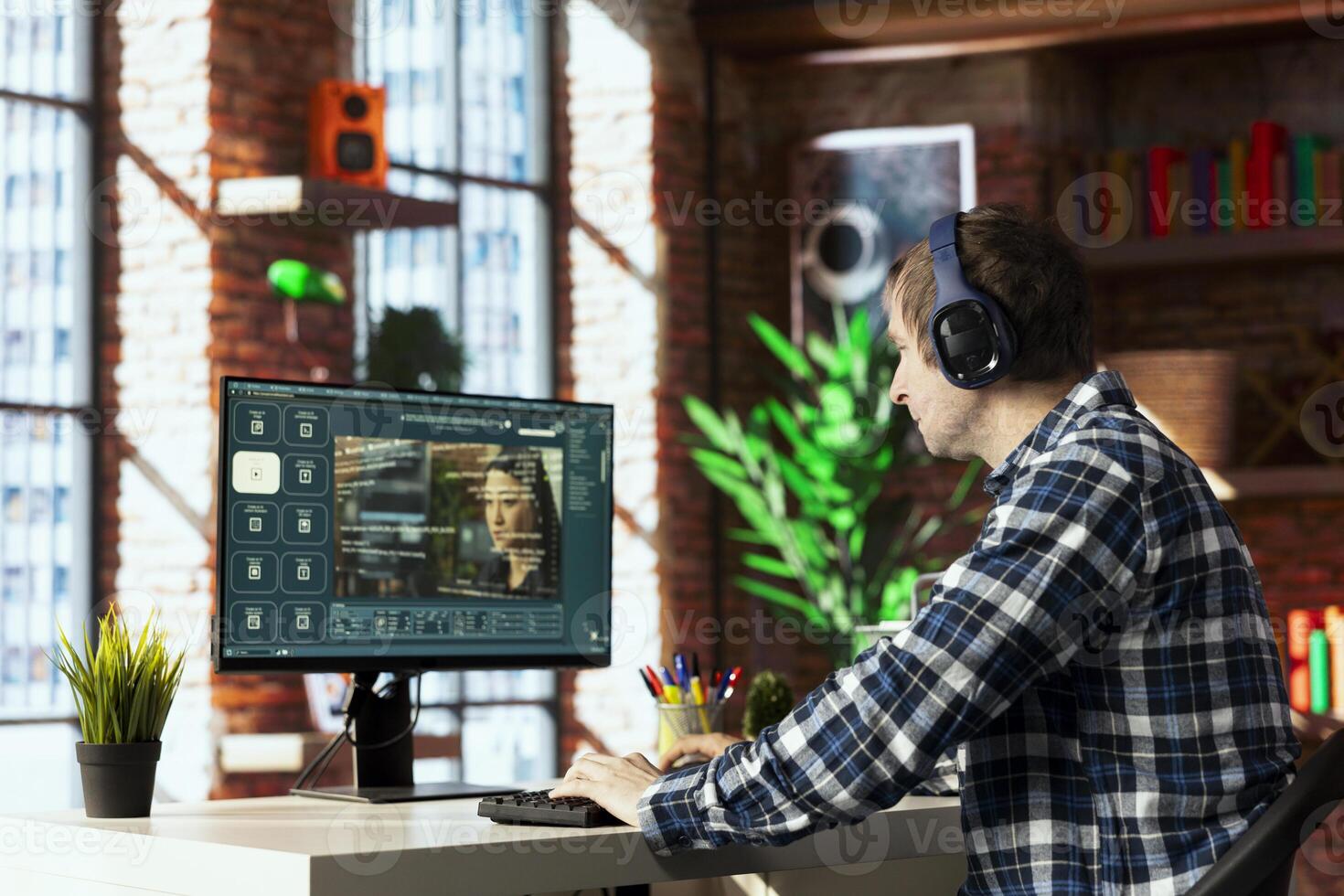 Man in home office uses artificial intelligence to generate compelling videos from basic text prompts. Person uses AI GPT generating clips using computer vision and natural language processing photo