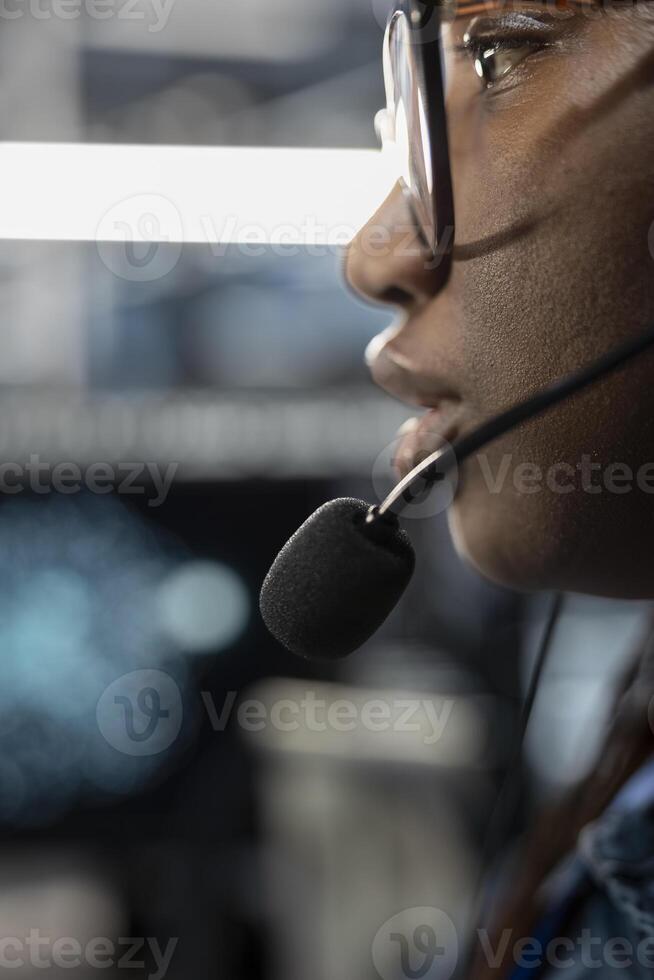 Close up of admin in data center providing technical support to customers, troubleshooting issues. High tech server hub employee carrying out operational technical interventions requested by clients photo