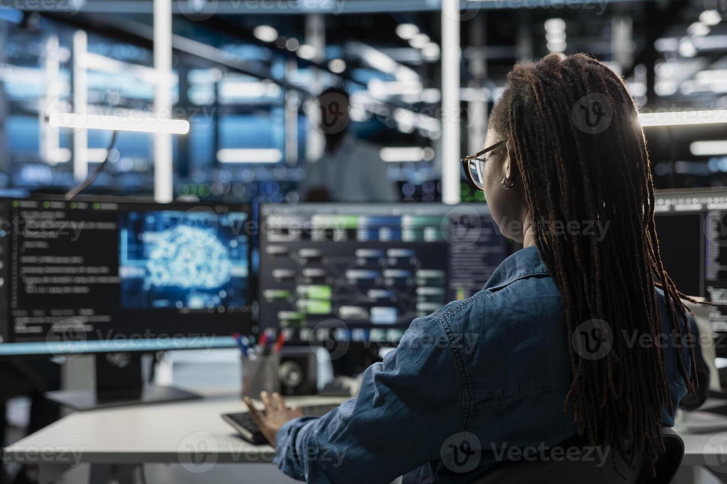Engineer using AI computer to do checkup in server room providing vast computing resources and storage, enabling artificial intelligence to process massive datasets for training and inference photo