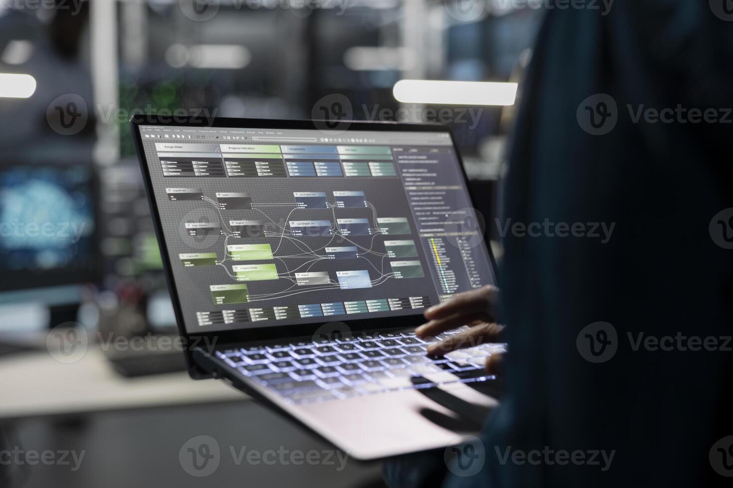 Engineer in data center uses AI technology on laptop for machine learning workloads. Server hub facility employee using artificial intelligence on notebook to perform demanding computing tasks photo