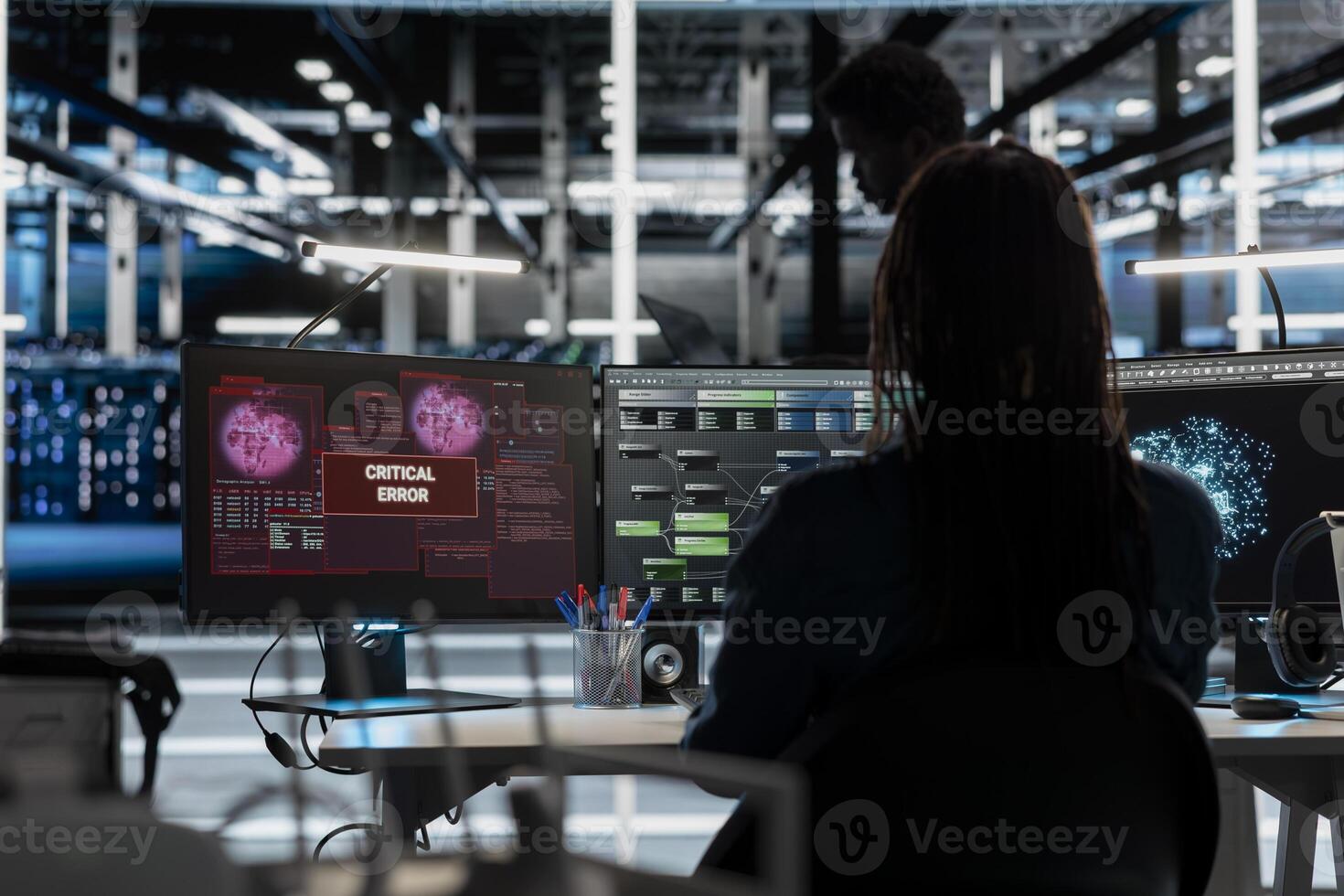 Data center employee receiving critical error popup while using artificial intelligence visualization tools. Server hub worker receiving warning message while looking at insights photo