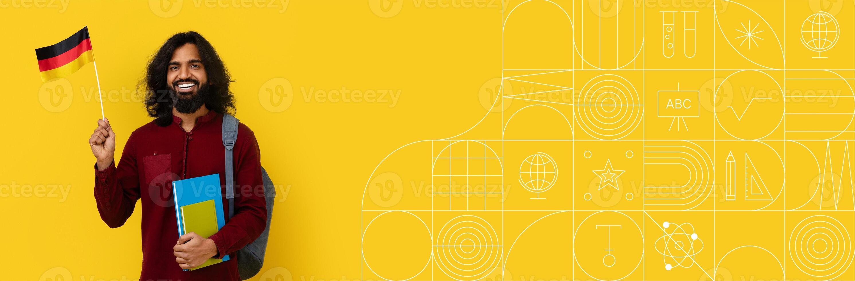 A cheerful student holds a flag while standing with books in a bright and colorful environment. The background features a painted design, enhancing the educational atmosphere. photo