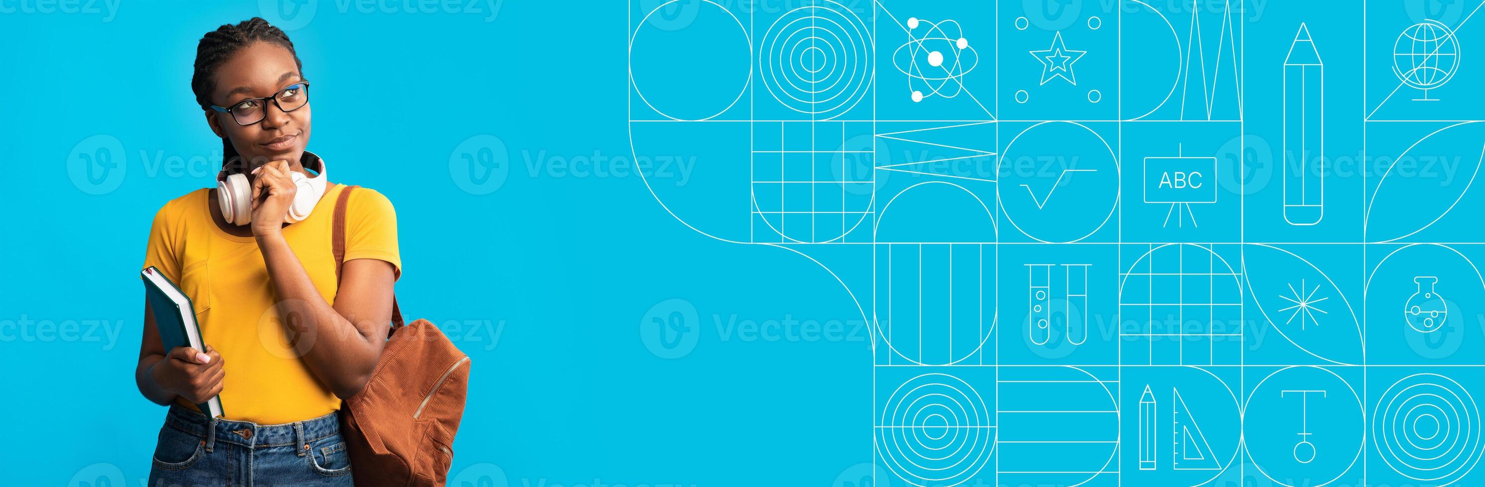 A student stands confidently with a notebook and backpack, focused on studying in a colorful environment. The bright background showcases educational themes and learning elements, inspiring curiosity. photo