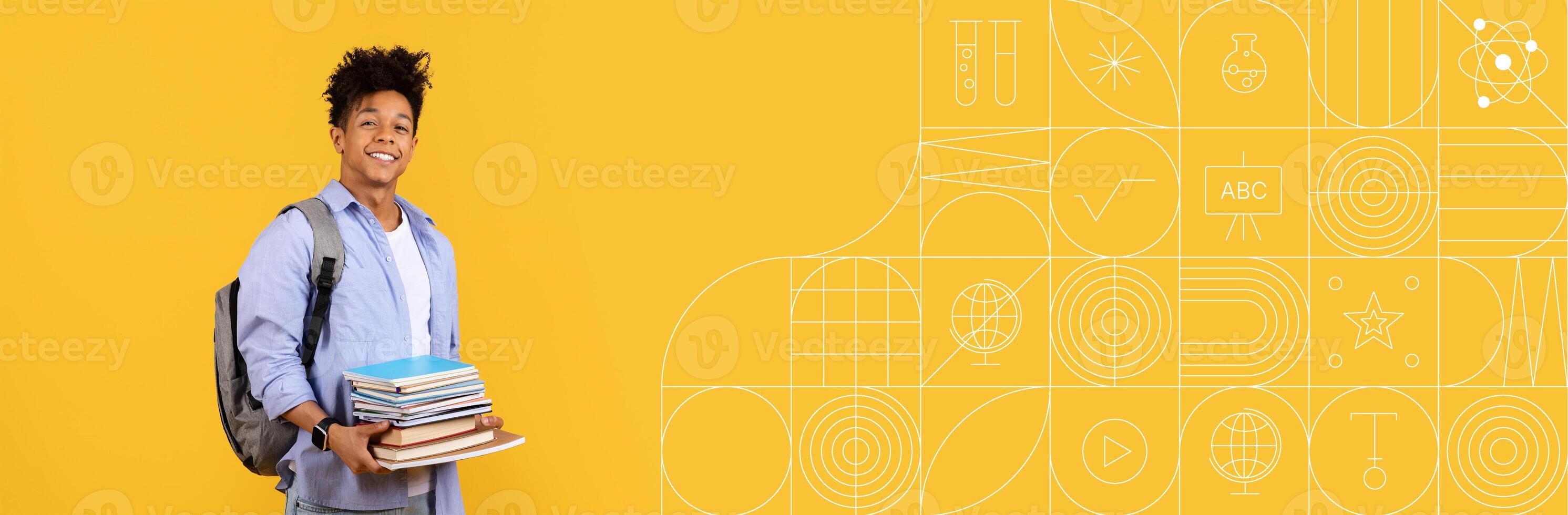 A student holds several books while wearing a backpack, displaying enthusiasm for education. The vibrant yellow backdrop enhances the learning atmosphere, ideal for studying and exploration. photo