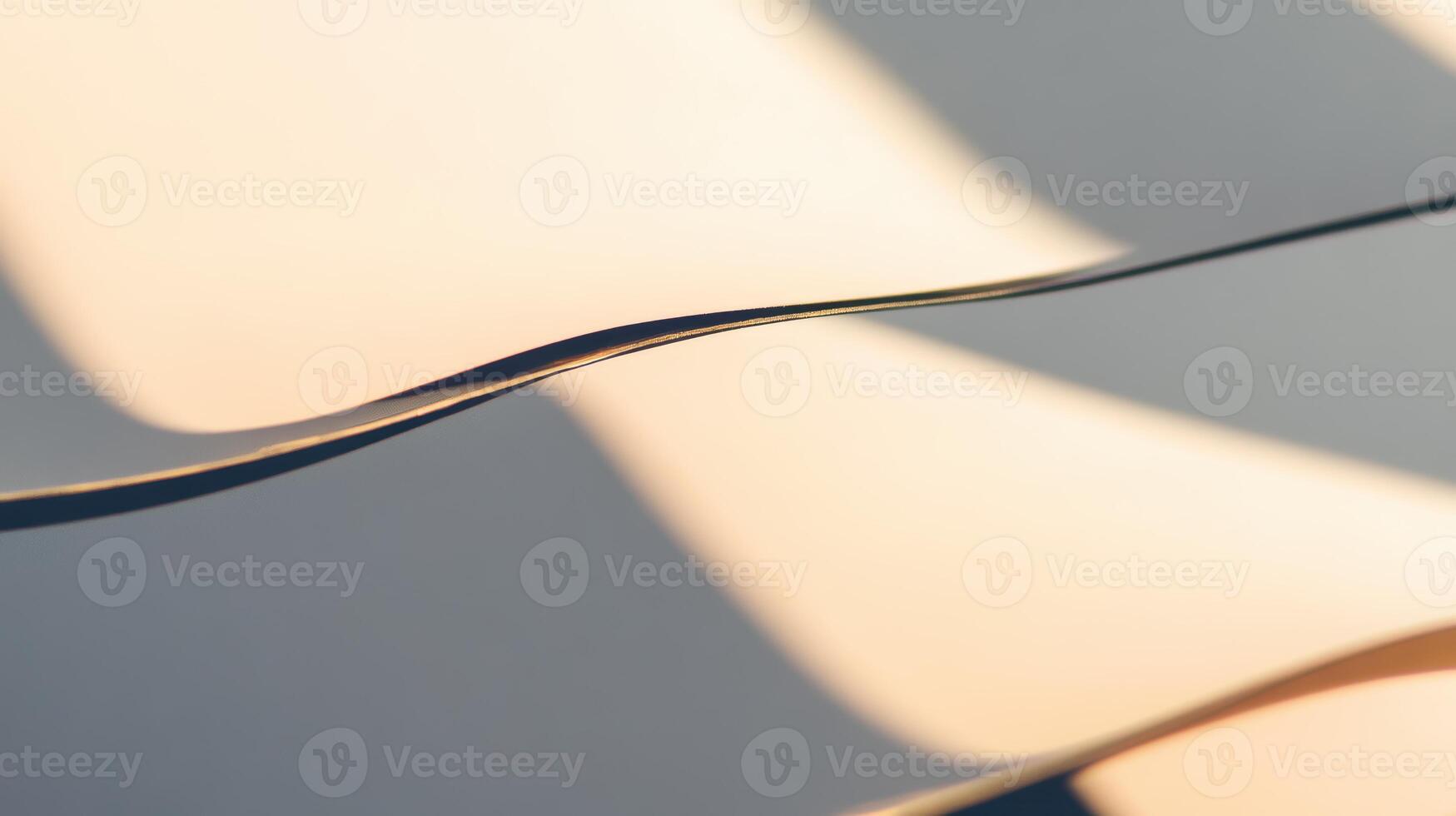 Soft shadows create elegant curves on a surface in sunlight photo