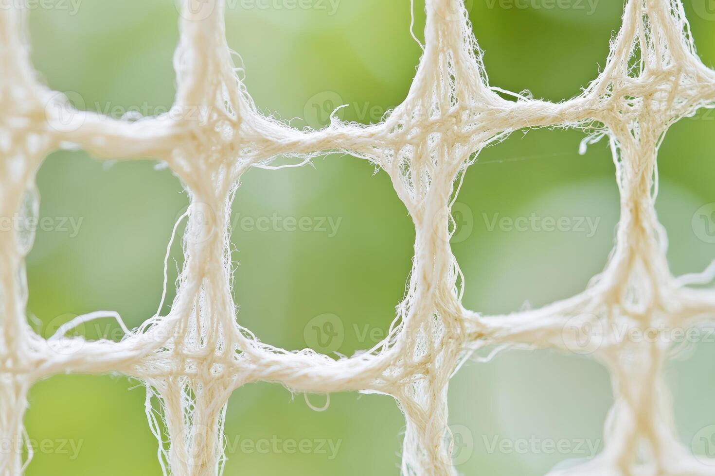 Close-up of a textured net in a soft natural light setting photo