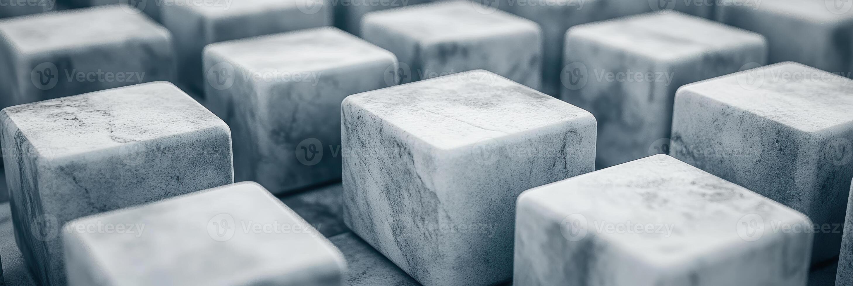 Marble cubes arranged in a grid pattern on a surface photo