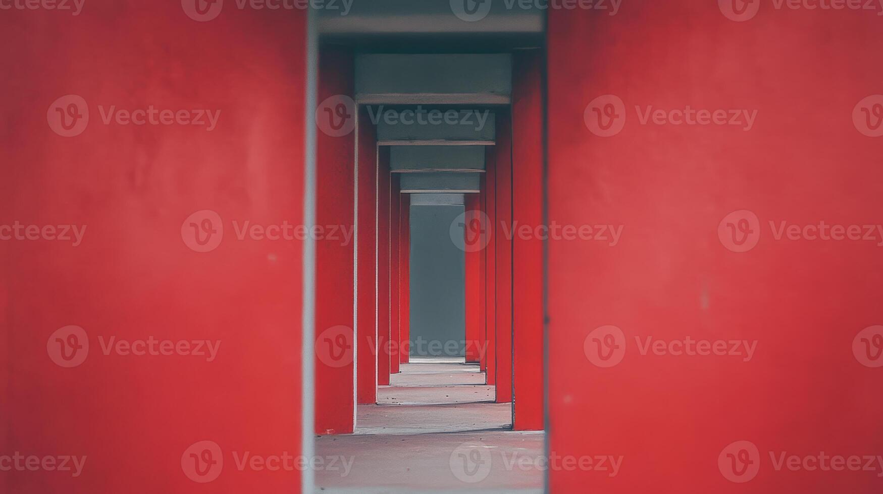 Vibrant red columns create a striking pathway in architecture photo