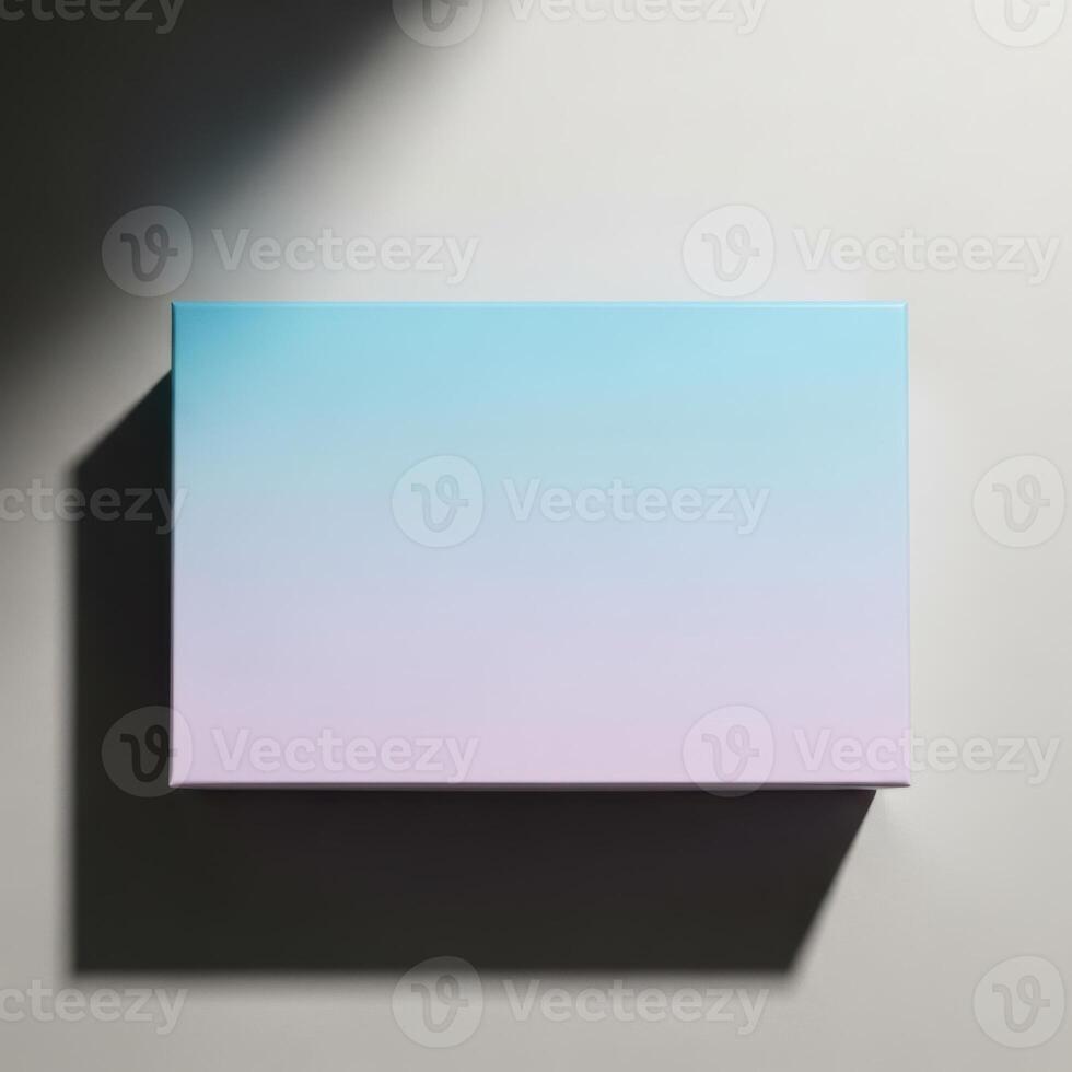 A rectangular blank card with a soft blue to purple gradient casting a shadow isolated on white background photo