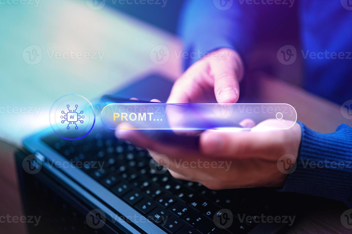 Hands typing on a smartphone while searching for information on a laptop in a modern workspace photo