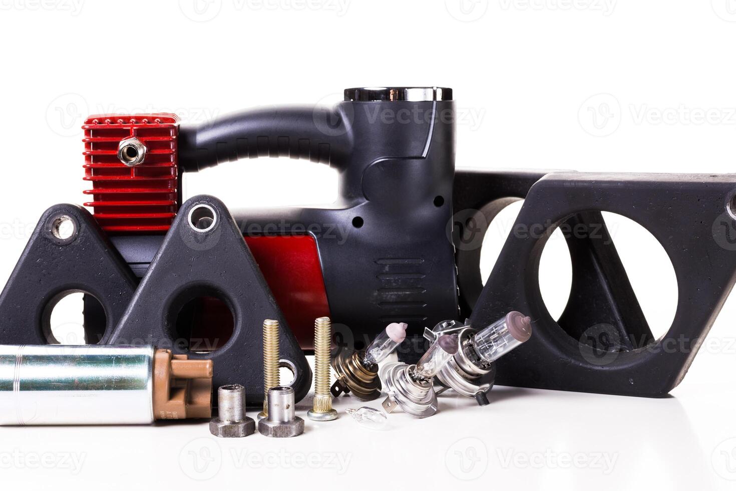 Various mechanical components arranged for inspection in a workshop setting photo