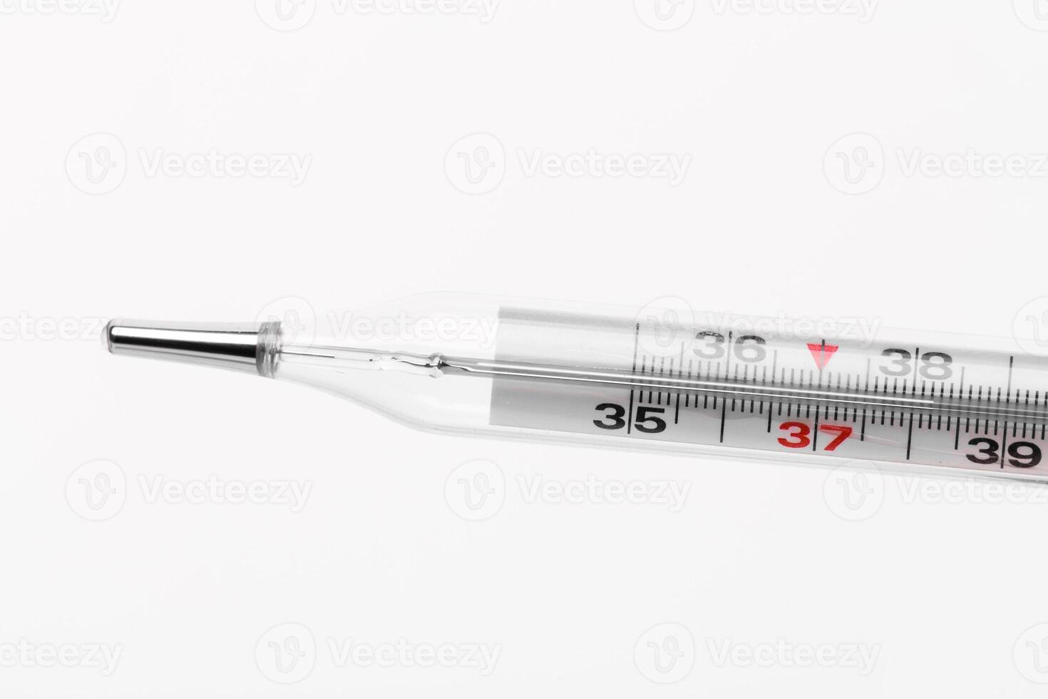Mercury thermometer displaying temperature around 37 degrees Celsius on a white background photo