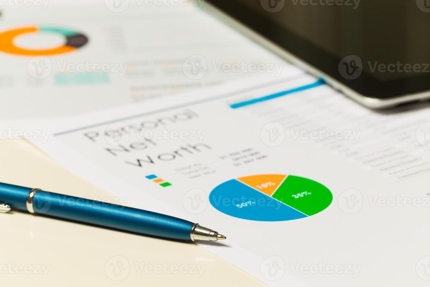 Financial analysis report showing personal net worth with charts and graphs on a desk photo