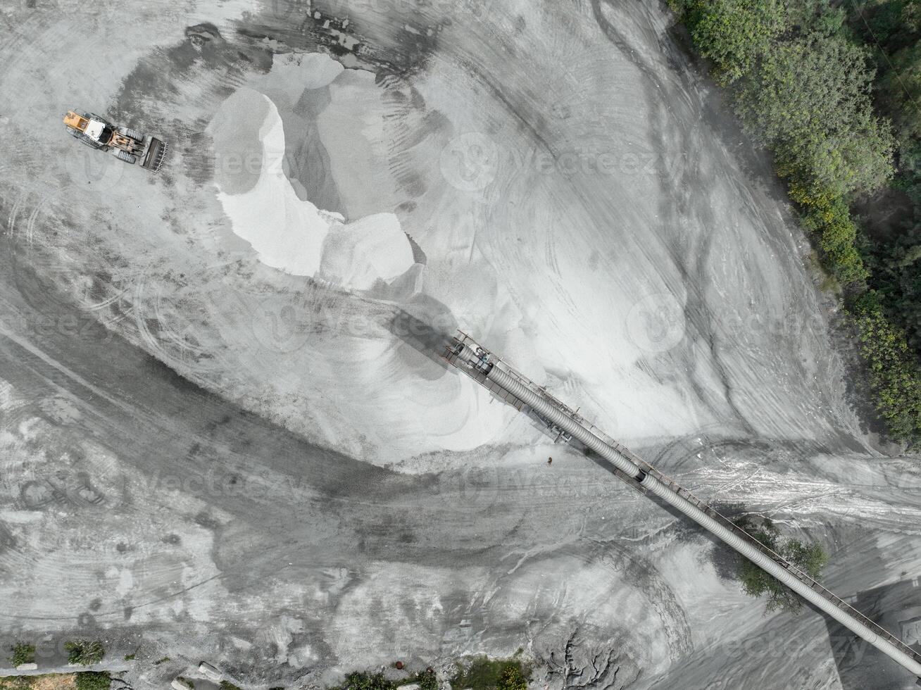 Aerial view of granite and limestone crushing plant with excavators processing raw stone into construction aggregates for concrete and infrastructure development. Stone mill factory. photo