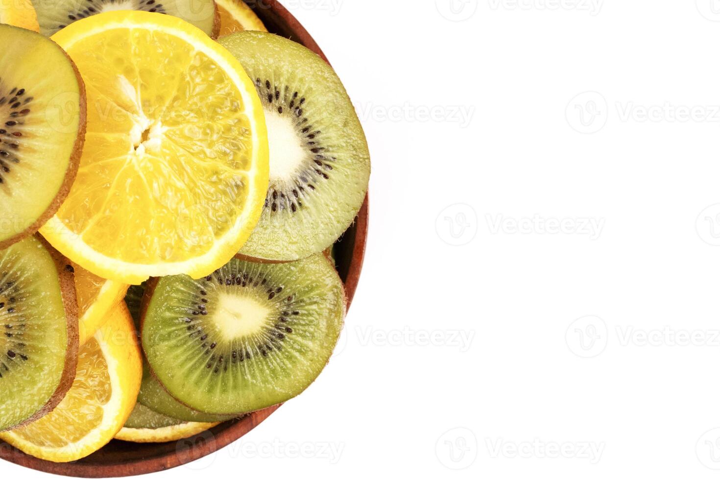 Sliced kiwi and orange create vibrant corner element for text layout and healthy eating design. photo